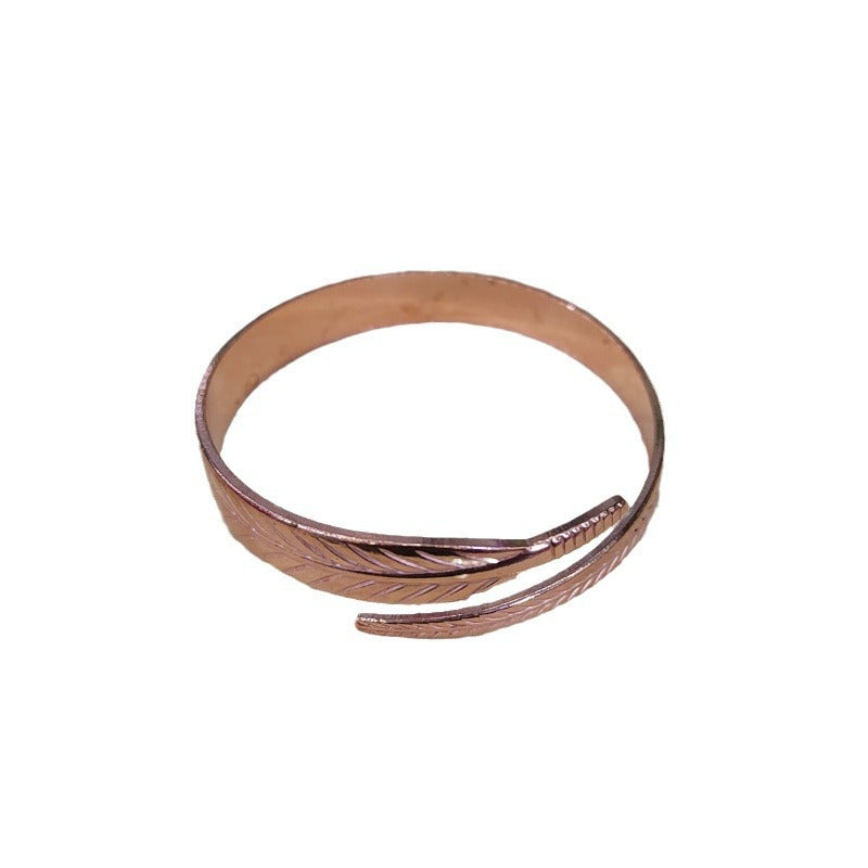 Bracelet en cuivre rétro avec un motif de feuille