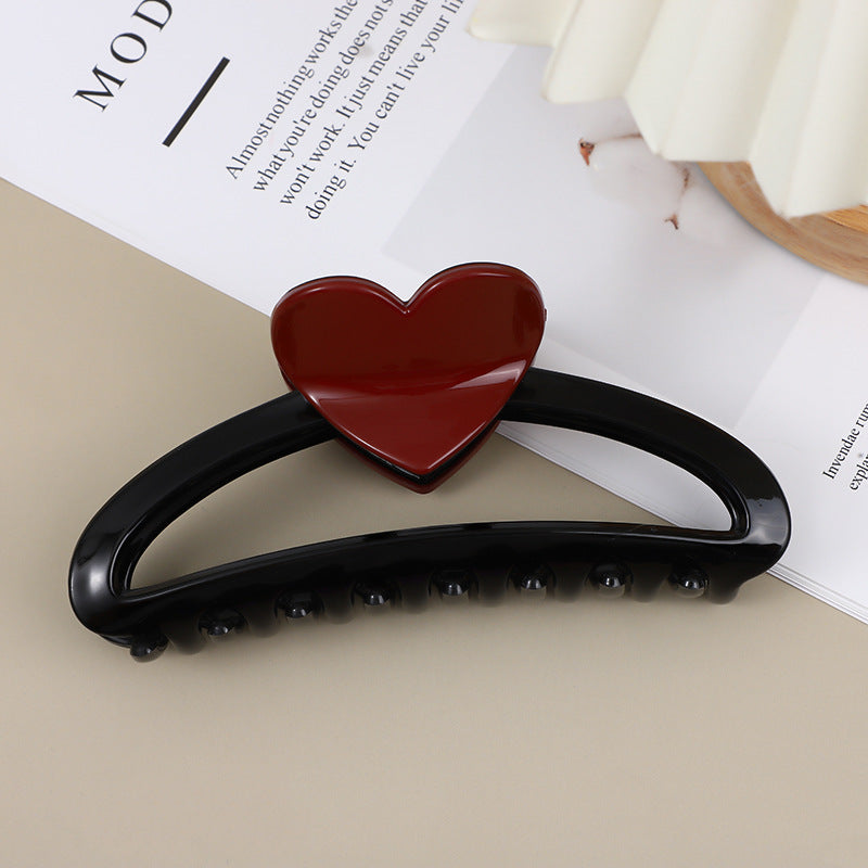 Pour les cheveux épais dos à la tête updo avec un pinceau de requin ou une griffe de cheveux pour les femmes