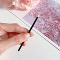 Eyeliner jetable avec un embout en fibre et un applicateur de brosse