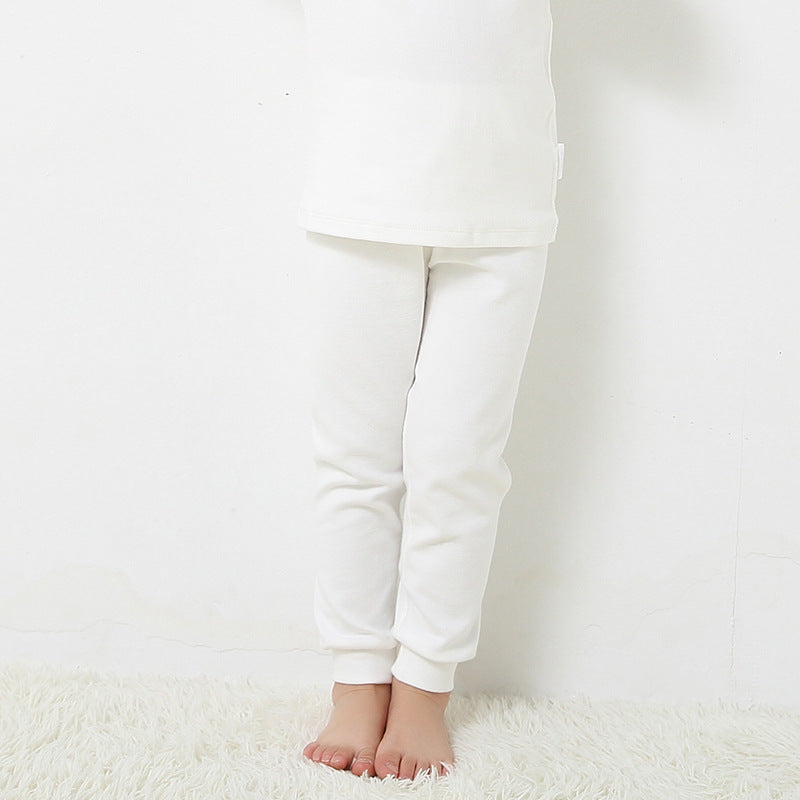 Les garçons et les filles gardent les leggings élastiques chauds