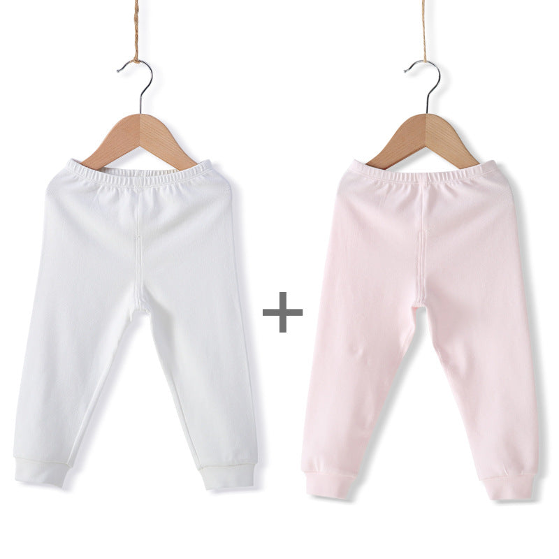 Les garçons et les filles gardent les leggings élastiques chauds