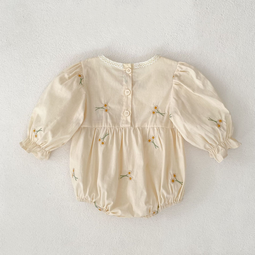 Baby bodysuit with long sleeves, bow, and embroidery