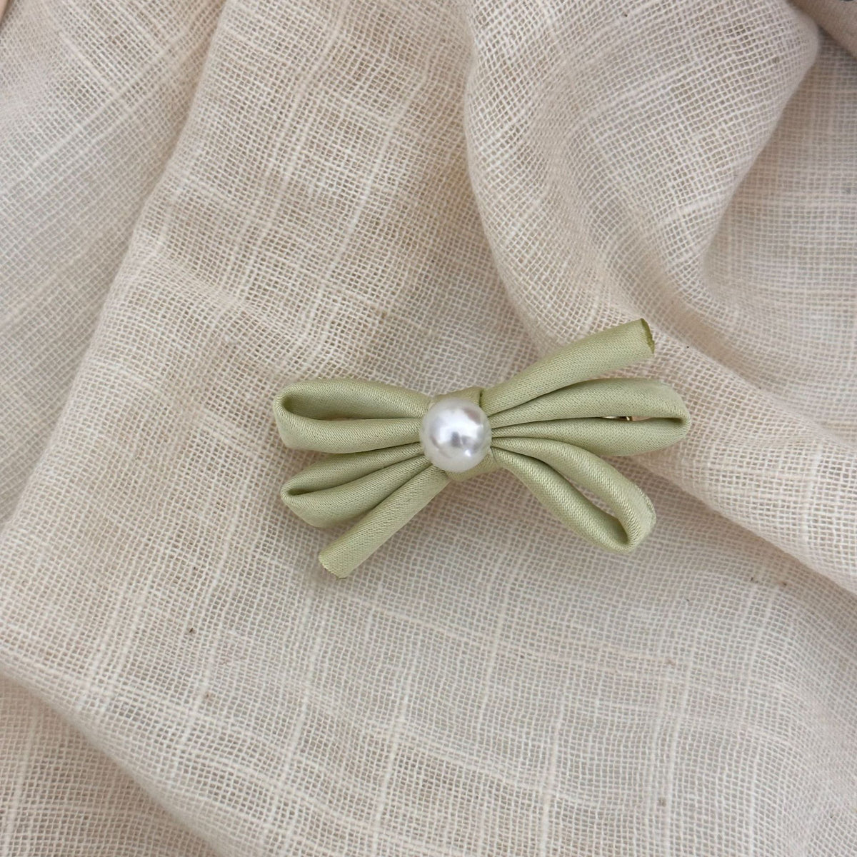 Clip latéral Bangs Pearl Bow Une paire de clips de canard