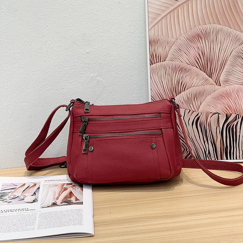 Sac à main en cuir de vache avec bande transversale en cuir véritable