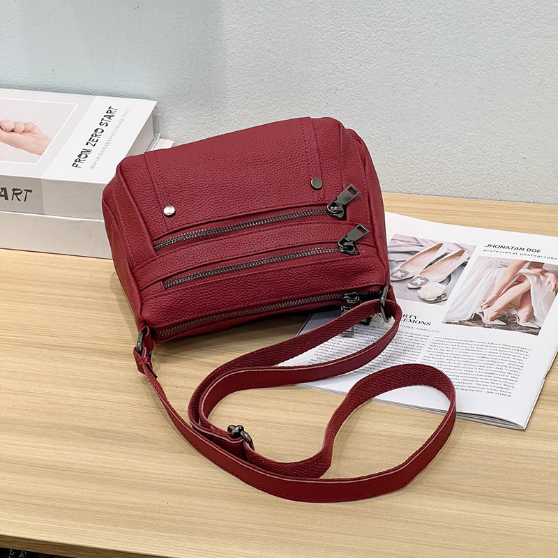 Sac à main en cuir de vache avec bande transversale en cuir véritable