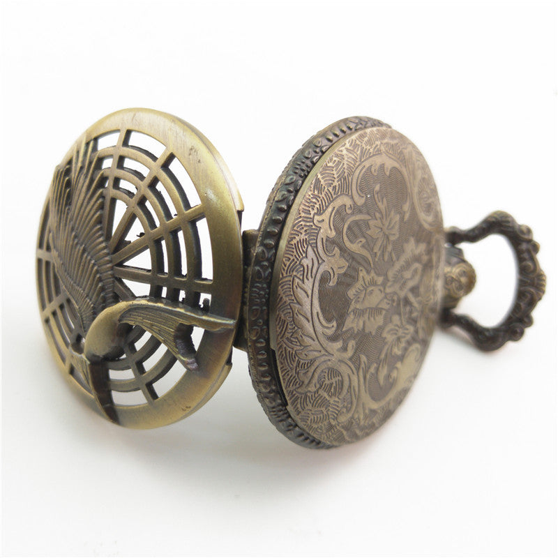 Vieille montre de poche fléchée aux gros oiseaux