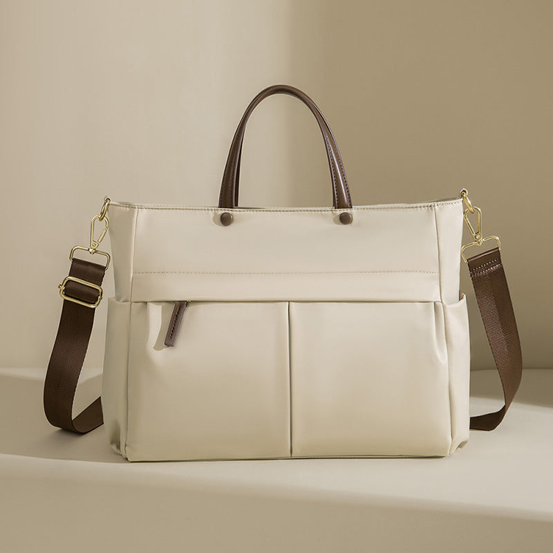 La mallette portable femme de mode grande capacité
