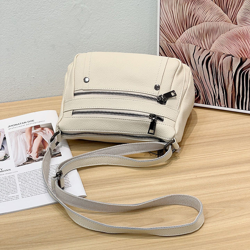 Sac à main en cuir de vache avec bande transversale en cuir véritable