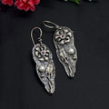 Boucles d'oreilles sculptées et incrustées de diamants