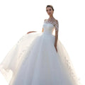 Robe de mariée brodée à manches longues en mesh