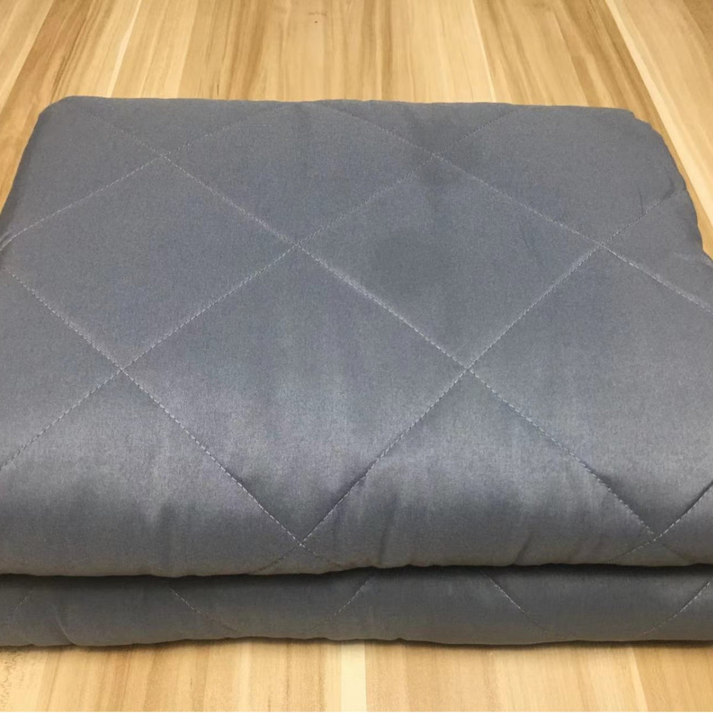 Couverture gravitationnelle avec remplissage de perles de verre et densité accrue