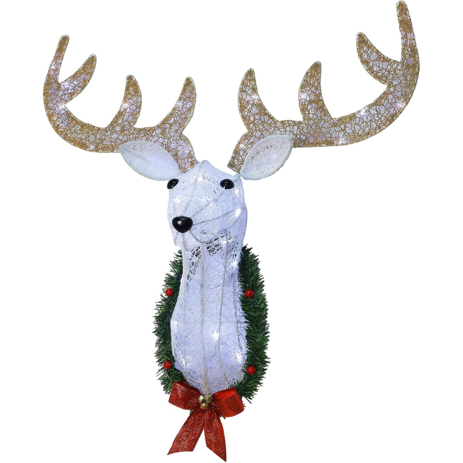 Tête de renne au mur de Noël éclairé