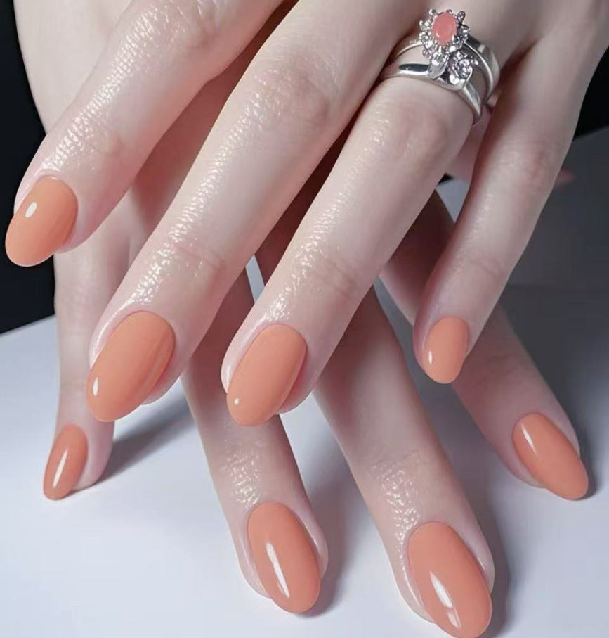 Les ongles artificiels en forme d'amandes longs de couleur solide pour femmes