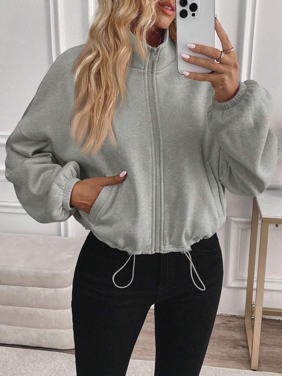 Long-sleeved jacket with drawstring and zip closure