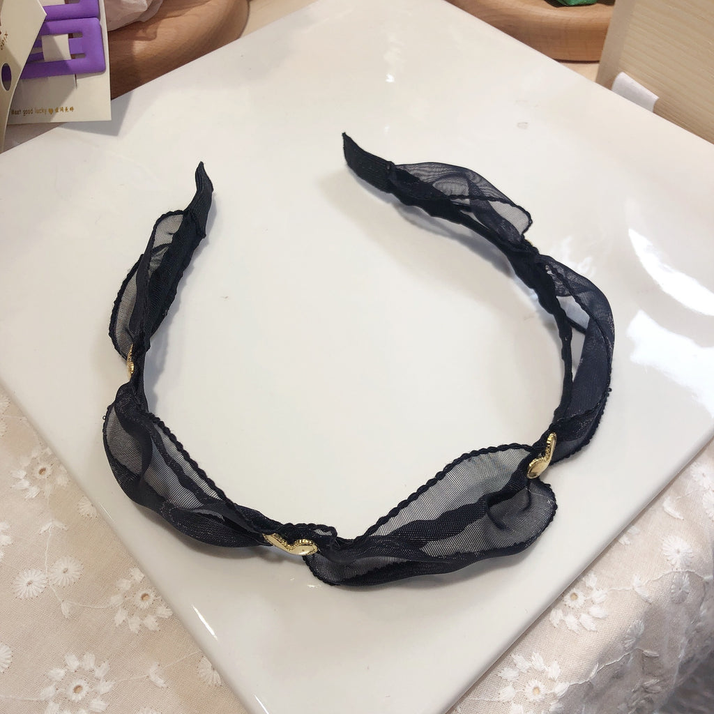 Exaggerated Black Wood Ear Hoop Hairstyle