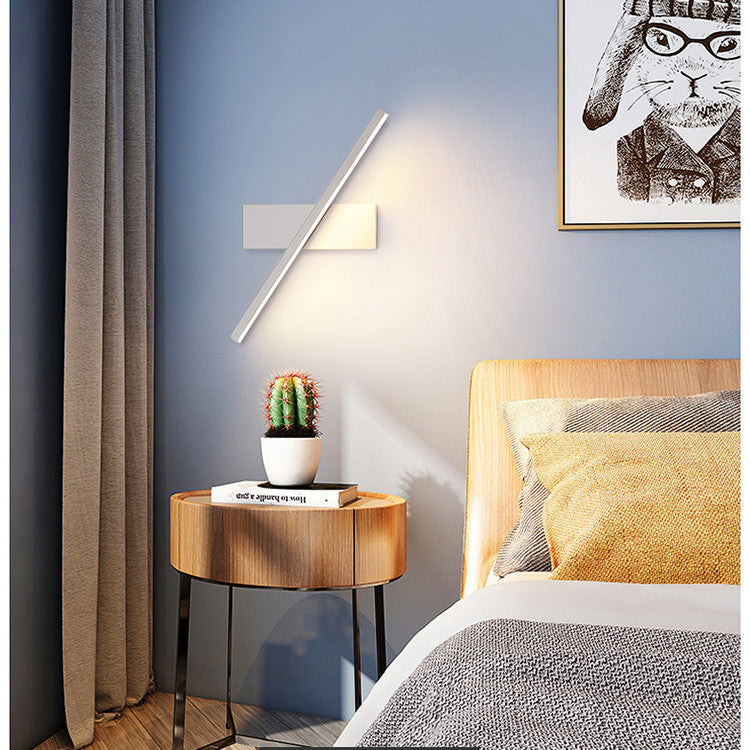 Rotating bedside wall lamp