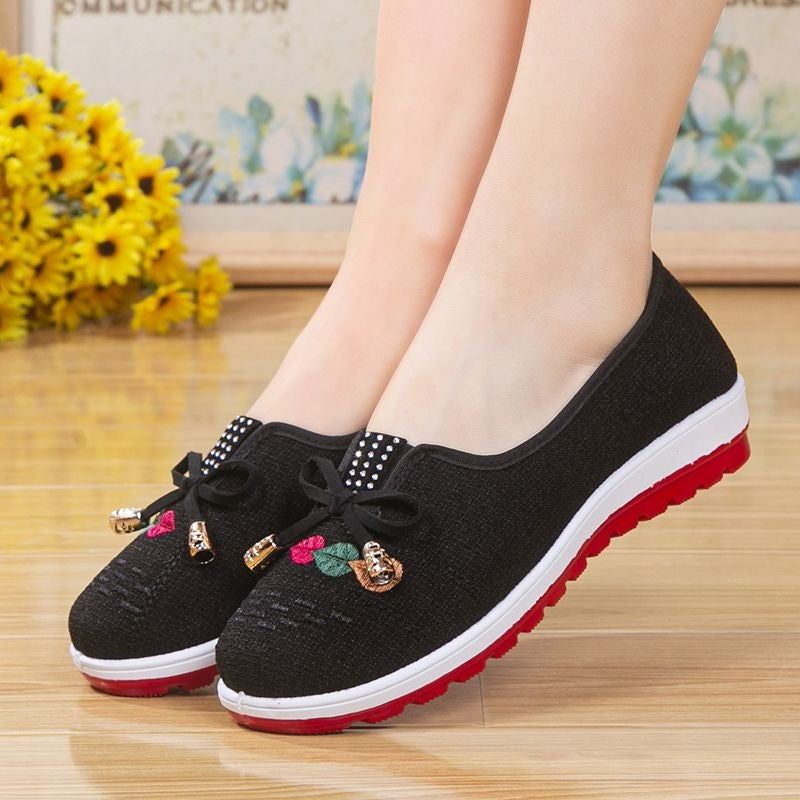 Chaussures en tissu brodé antidérapant avec une semelle souple