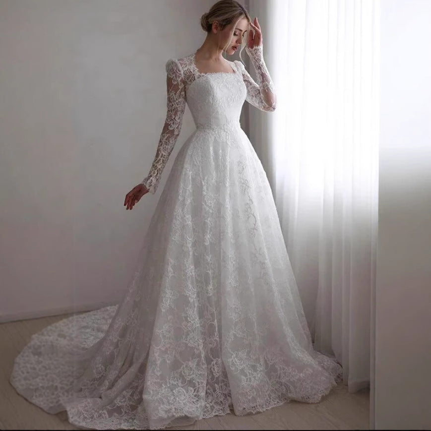 Robe de mariée à manches longues brodées