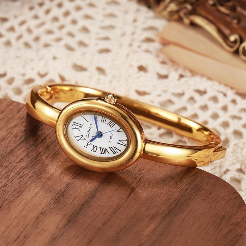 Montre femme ovale Niche légère-luxe avec une lunette diamant or rose