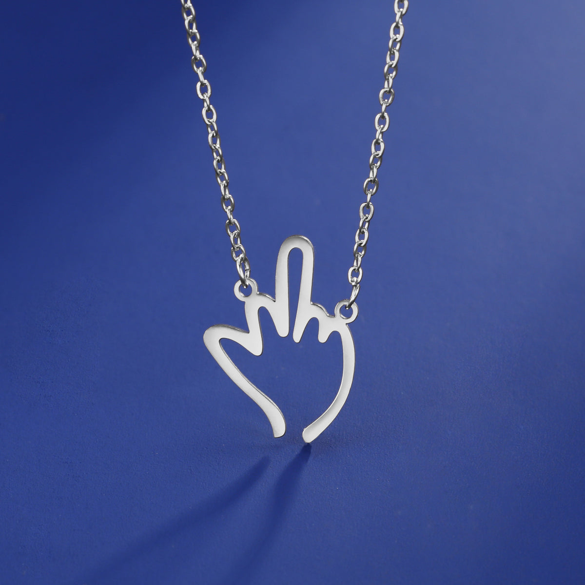 Collier en acier inoxydable pendentif à doigts moyens