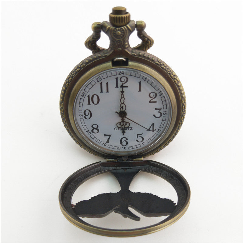 Vieille montre de poche fléchée aux gros oiseaux