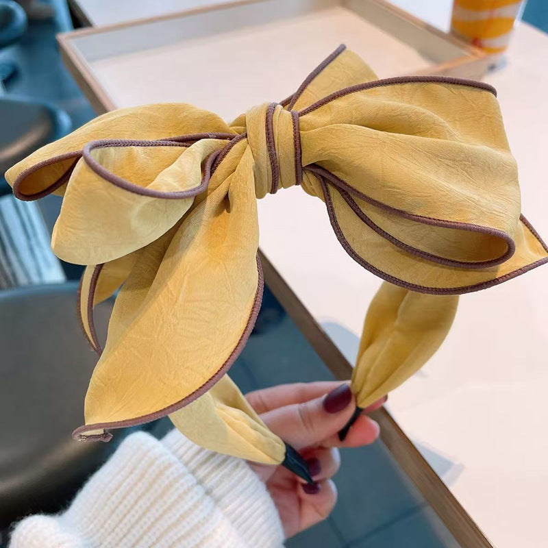 Bandeau large bordé avec un arc 3D pour les femmes