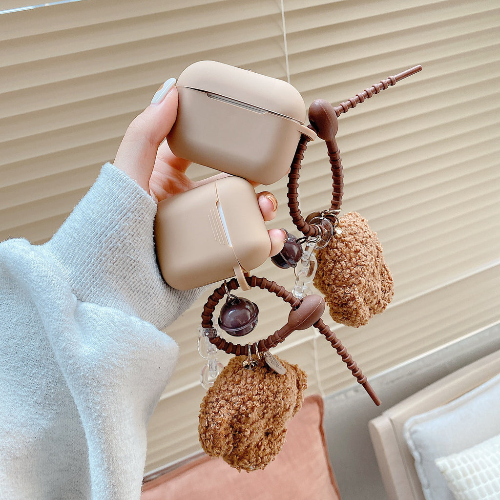 Couverture d'écouteur en couleur solide sans fil Bluetooth Soft Shell Pendentif pour chiots de dessin animé