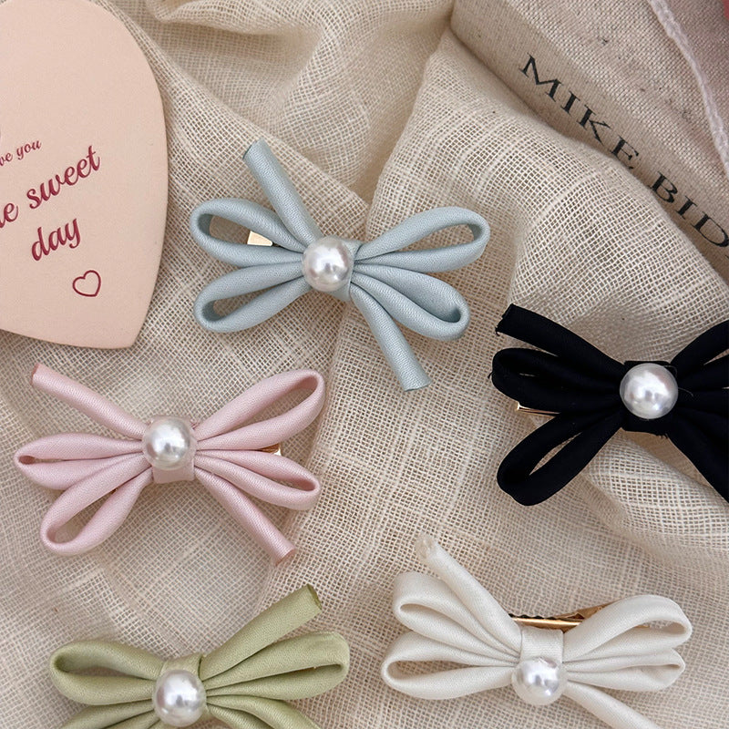 Clip latéral Bangs Pearl Bow Une paire de clips de canard