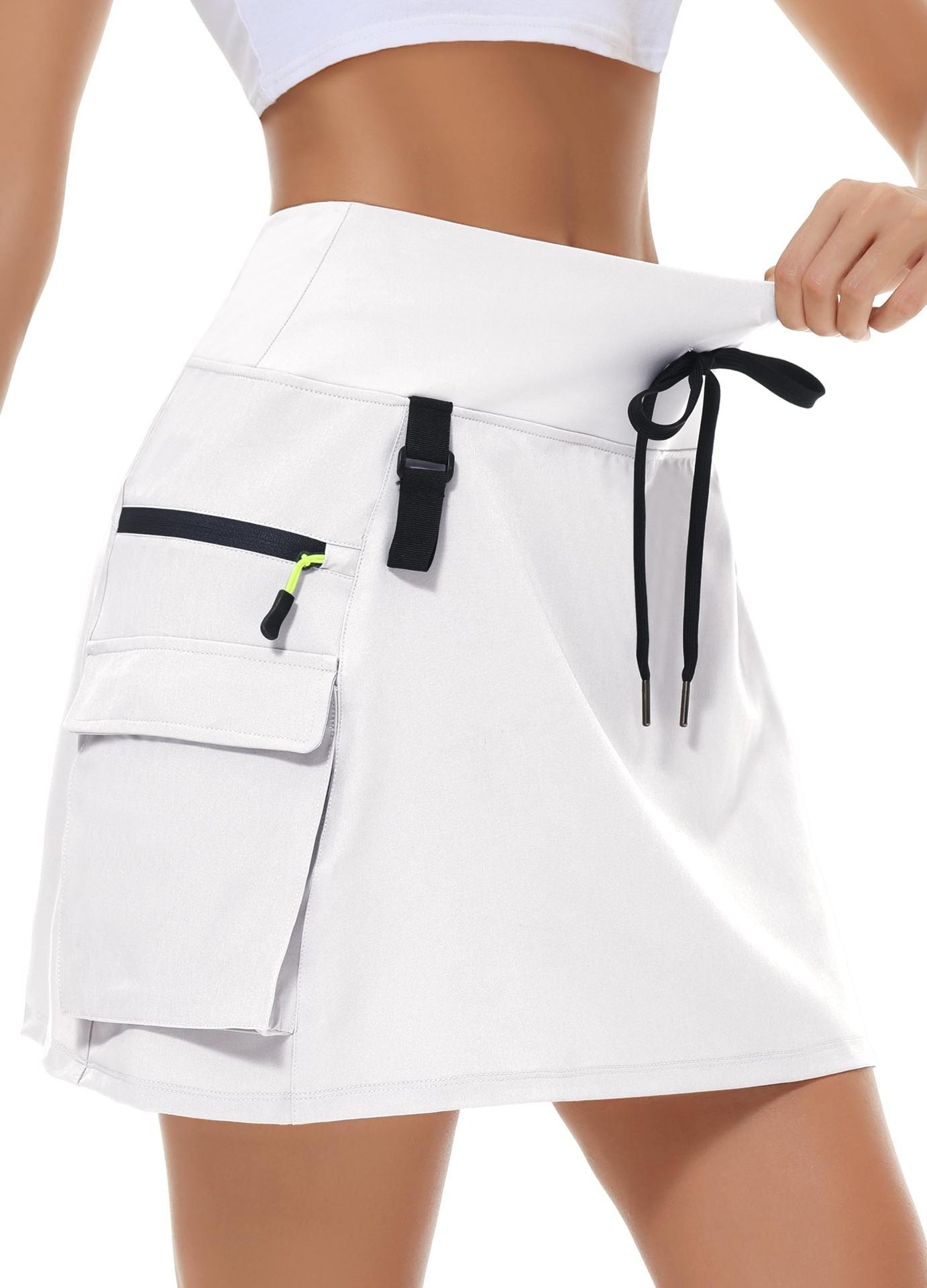 Jupe de tennis à manches rapides en polyester à vente chaude pour femmes avec une taille élastique et des poches zippées