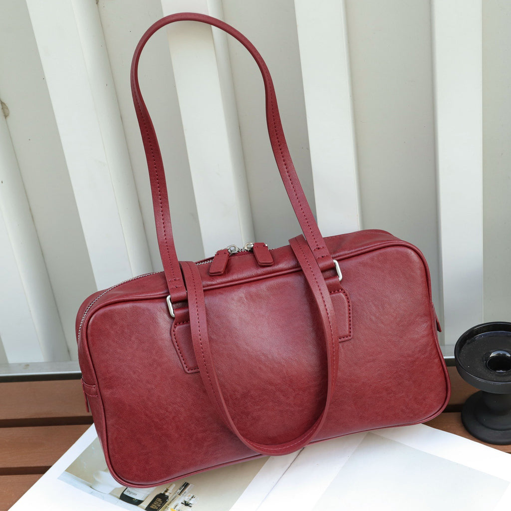 Couche de tête Cowhide sac pour femmes Armpit sac de bowling sac sac de fourre-tout Niche main en cuir haut de gamme