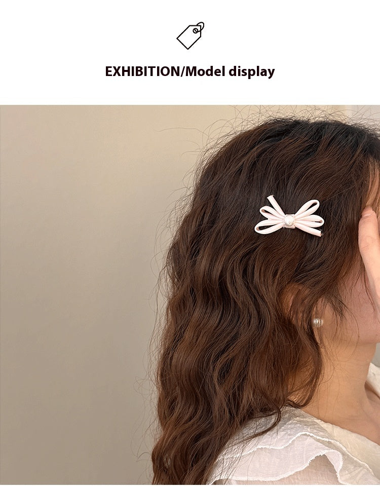 Clip latéral Bangs Pearl Bow Une paire de clips de canard