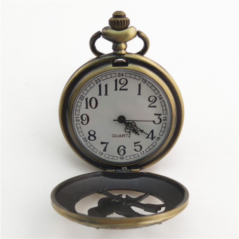 Vieille montre de poche fléchée aux gros oiseaux