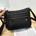 Sac à main en cuir de vache avec bande transversale en cuir véritable