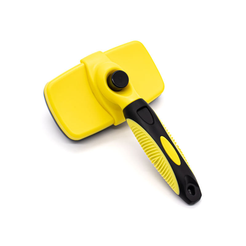Brosse auto-nettoyante pour chien pour la couverture
