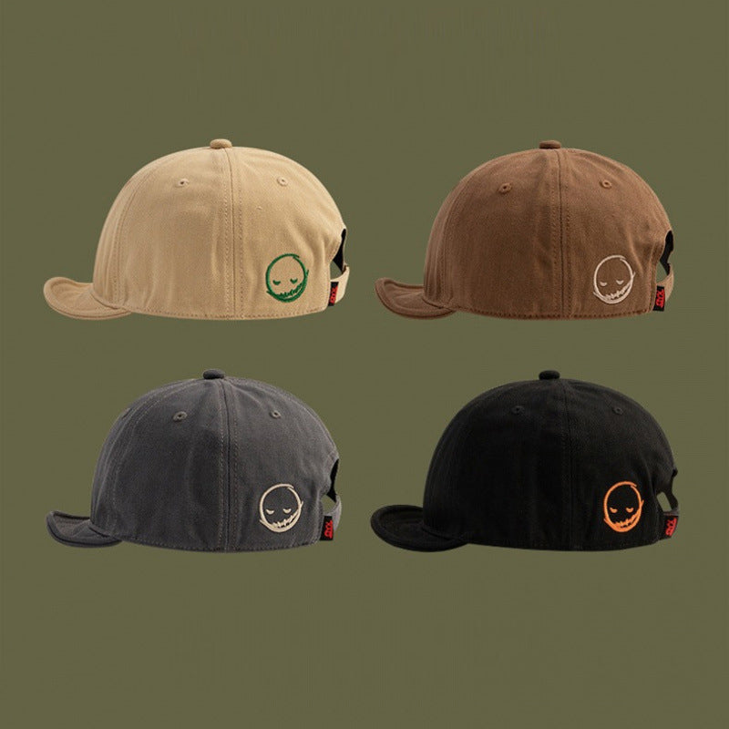 Men's and women's style Embroidered solid color Simple smile face short adjustable brim