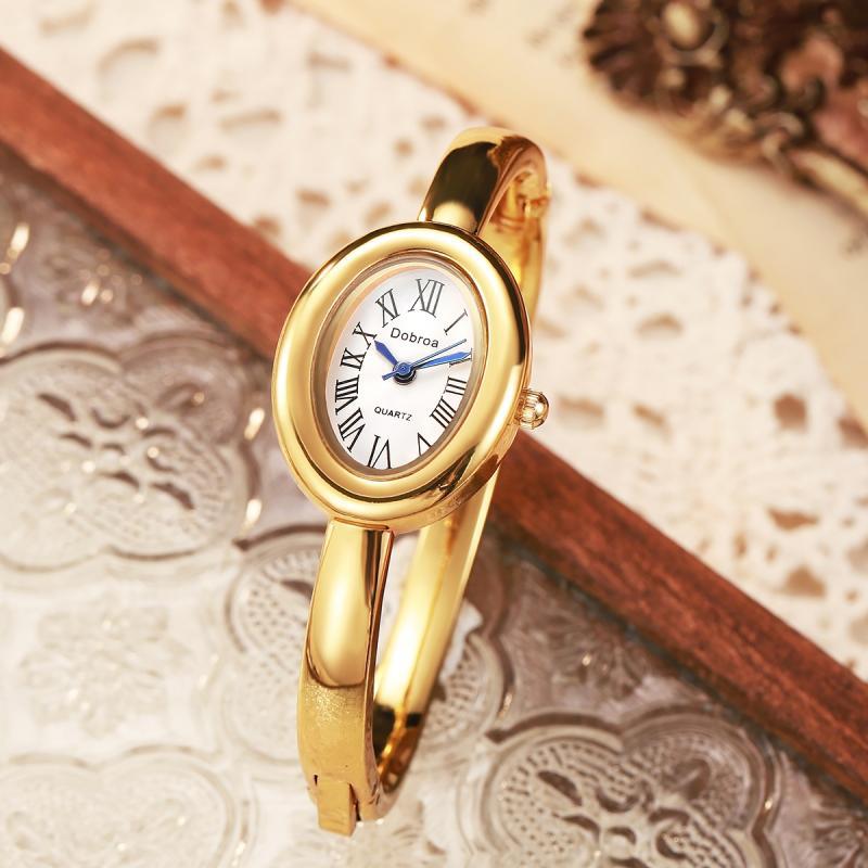 Montre femme ovale Niche légère-luxe avec une lunette diamant or rose