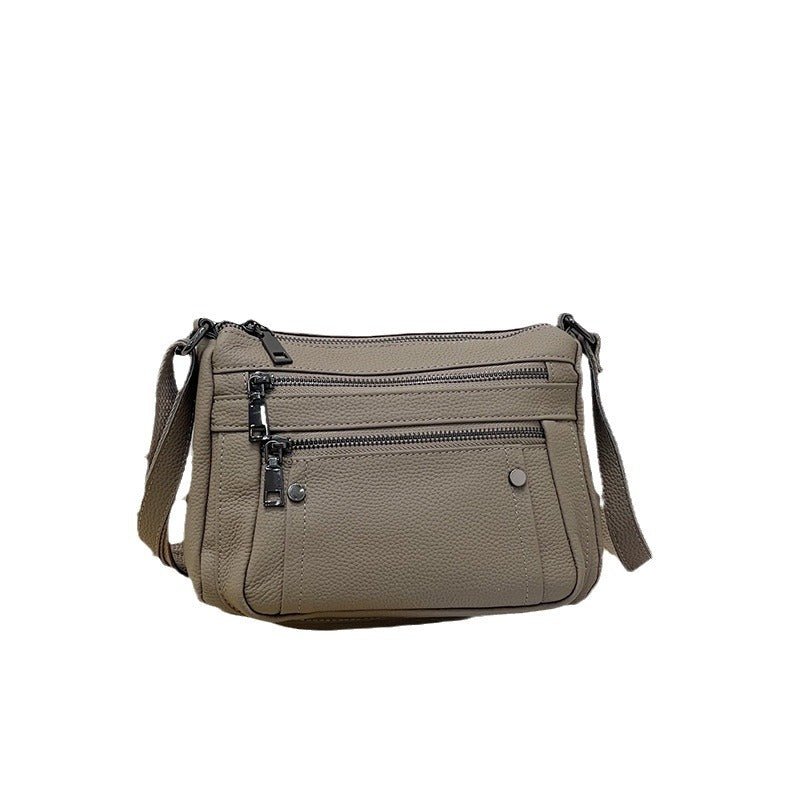Sac à main en cuir de vache avec bande transversale en cuir véritable