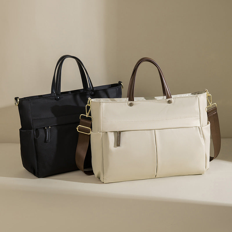 La mallette portable femme de mode grande capacité
