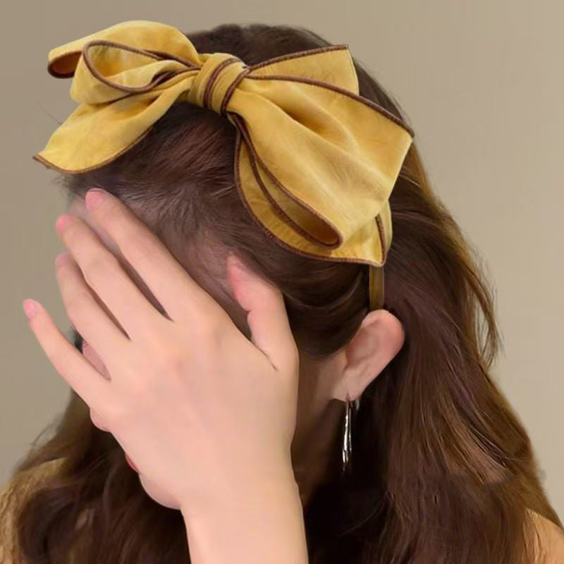 Bandeau large bordé avec un arc 3D pour les femmes